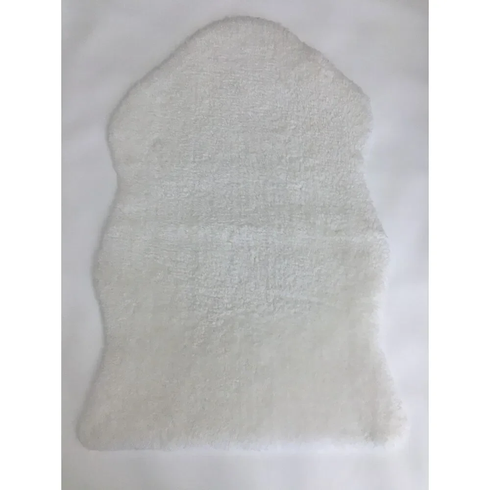 Soft and cozy white faux sheepskin / faux fur accent rug